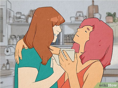 Two women holding coffee mugs, embracing each other.